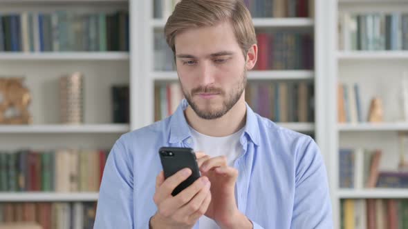 Man Using Smartphone Browsing Internet