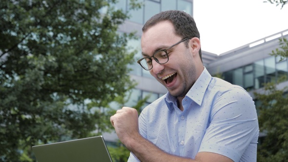 Comic Emotion. Man Surprised with Laptop Computer Looking