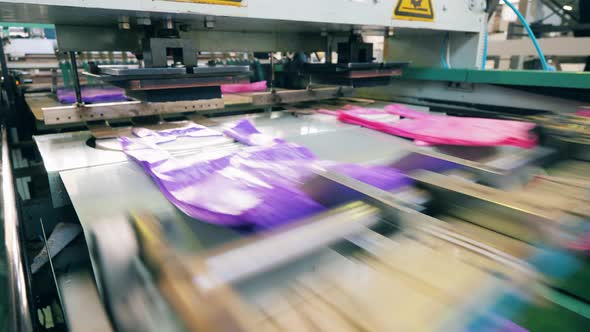 Close Up Shot of a Colourful Plastic Bag Manufacturing Machine. Polyethylene Bag Production.