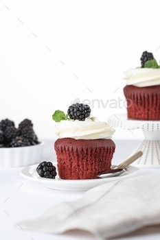 Velvet cupcakes with blackberries