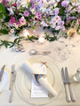 Wedding guest tablescape setup with candles in white gold and pastel colours  - PhotoDune Item for Sale