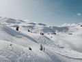 Snowy white mountain valley covered in snow on a sunny day - PhotoDune Item for Sale