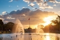 View of a fountain in Rizal Park with a flag of the Philippines under beautiful sunset light - PhotoDune Item for Sale