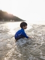 kid playing sea, sea, sunset, beach, sand, happy, lifestyle - PhotoDune Item for Sale