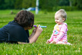 Mother spending time with her baby girl on the grass - PhotoDune Item for Sale