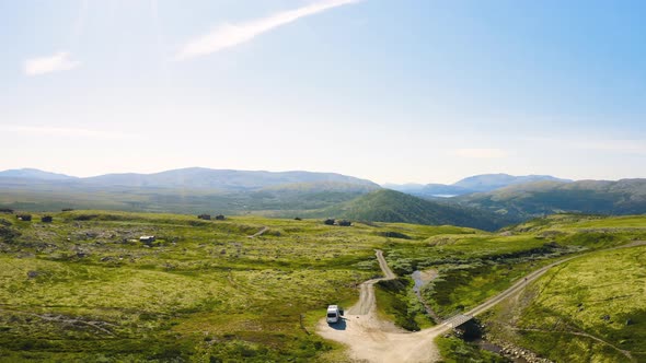 View Of An Isolated Camper Van Amidst Remote Terrain At Rondane National Park At Summer In Norway. -