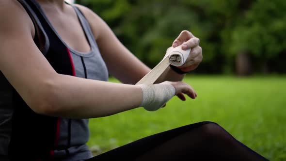 Girl Bandage on Hand in Nature
