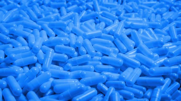 Blue Pharmaceutical Capsules Moving Shot