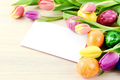 easter eggs and tulips with copy space on beige table background - PhotoDune Item for Sale