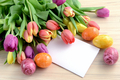Springtime decoration with tulips, easter eggs and white note paper copy space - PhotoDune Item for Sale