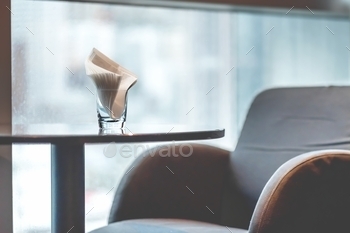 window background. Glass with tissues. Interior, design, hotel, window, bar, club, furniture, chair, brown, background, cafe, city, classic, comfort zone, comfortable, cozy, culture, dark, decoration, details, elegant, empty, glass, home, indoor, light, loft, lounge, modern, no people, nobody, objects, office, place, relax, restaurant, retro, room, seats, selective focus, service, shadows, soft, spending, style, table, time, tissue, upholstery, vintage