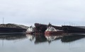 Two freight ships docked in Two Harbors, Minnesota with reflections on the water and overcast sky  - PhotoDune Item for Sale