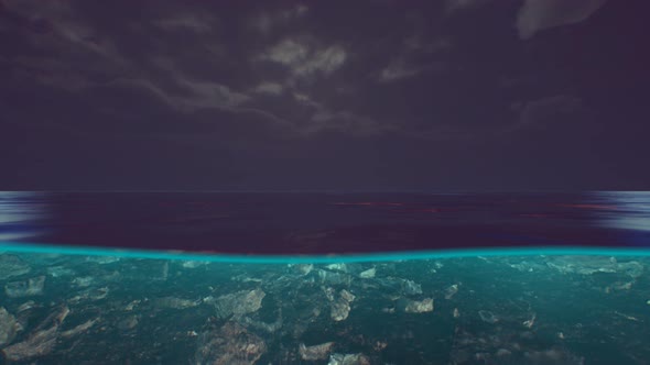 Split View Over and Under Water in the Caribbean Sea with Clouds