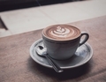 A cappuccino on a windowsill in a coffee shop.  - PhotoDune Item for Sale