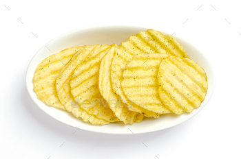 otato chips, in a white bowl. Crinkle-cut potatoes, deep fried in oil until crunchy, spiced with Japanese horseradish powder and seaweed flakes. Photo