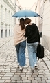LGBTQ+  couple walking along streets of Bratislava during the rain. Togetherness and equality concep - PhotoDune Item for Sale