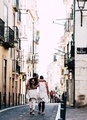 Gay Couple walking on the streets of Lisbon.  - PhotoDune Item for Sale