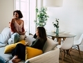 Two young women drinking wine in a modern stylish apartment - PhotoDune Item for Sale