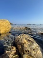 rocky seashore with clear water in sunny weather - PhotoDune Item for Sale