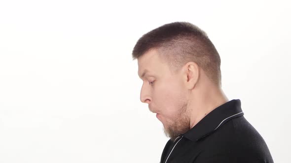 Young Man Eating Fast Food. White