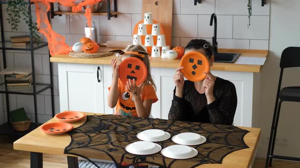 Mother with Daughter Having Fun in Halloween