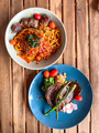Spaghetti bolognaise and rib eye steak on plate - PhotoDune Item for Sale