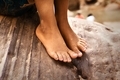 ⚡ NOMINATED!!!⚡ Young Boy Sitting On Rock, Closeup Of Bare Feet - PhotoDune Item for Sale