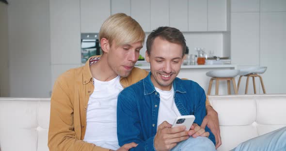 Surprised Two Males Gay Couple Winners Hold Smartphone Read Good News Amazed By Mobile Online Bet