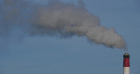 Smoke and air pollution from a incinerator chimney near Caen, Normandy, France.