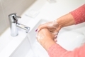 Woman washing hands with soap under running water  - PhotoDune Item for Sale