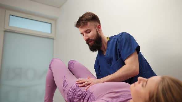 Girl Pelvis Being Manipulated By Osteopathic or Chiropractic Manual Therapist