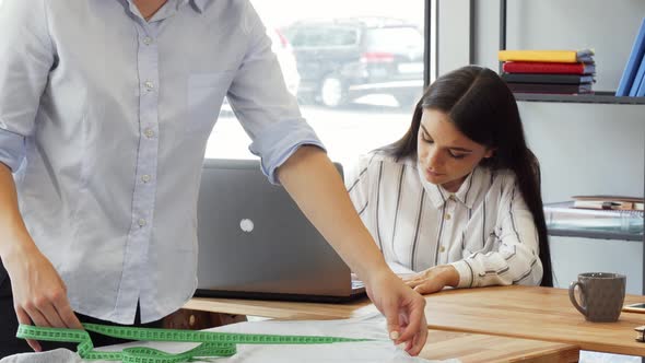 Team of Fashion Designers Working Together at the Office