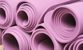 yoga mats folded on a shelf in fitness club. pilates and stretching equipment - PhotoDune Item for Sale