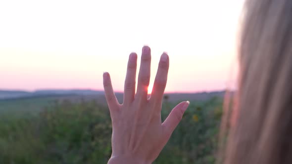 Close Up of Girl's Hand at Sunset