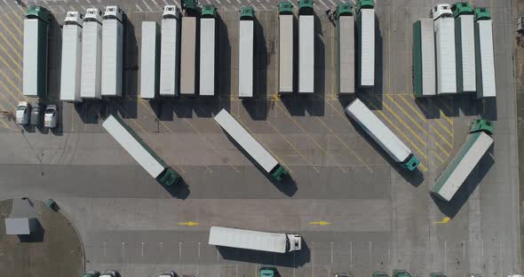 Buildings of Logistics Center, Warehouses Near the Highway, Truck Parking Process, View From Height