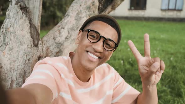 Selfie of Young Stylish African American with Glasses Man in Outdoors
