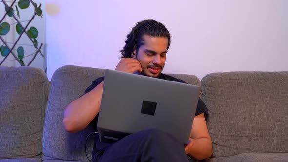 Frustrated Indian man feds up from working and closes the laptop