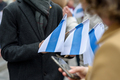 Person holding white-blue-white flags - PhotoDune Item for Sale