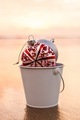 Christmas Decorations Collected In A White Bucket At The Beach  - PhotoDune Item for Sale