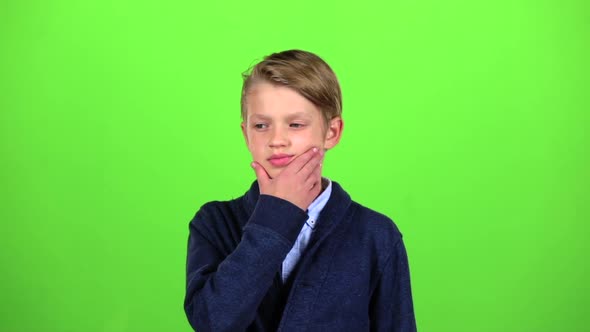 Boy Is Thinking About Important Things. Green Screen. Slow Motion