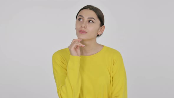 Pensive Spanish Woman Thinking on White Background