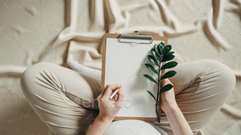 ynecology concept. Banner. Pregnant woman writing baby names list at home. New life, wellbeing, fertility, unborn baby health. Banner, copy space.