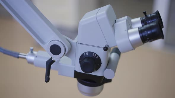 Closeup Dental Endodontic Binocular Microscope in Hospital Indoors
