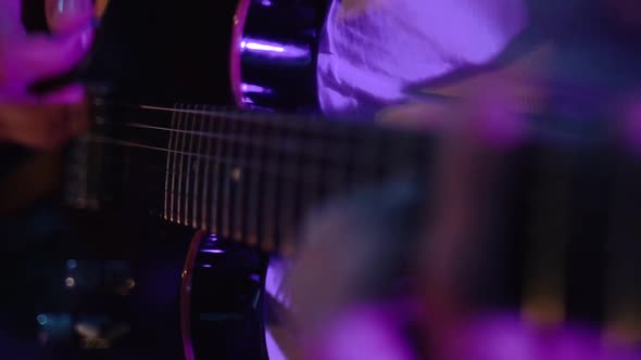 Musician Plays Electric Guitar at Concert