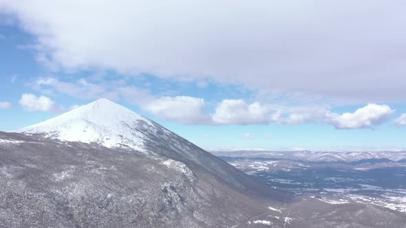 Cloudy sky above the Rtanj mountain by winter 4K drone video