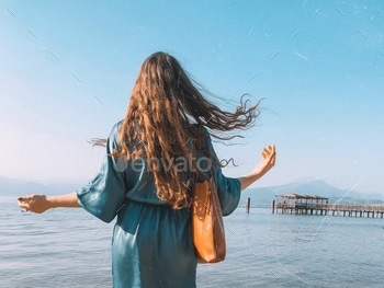 Woman on the beach, water, beautiful blue, windy hair, springtime, summer, lake, moments in nature 