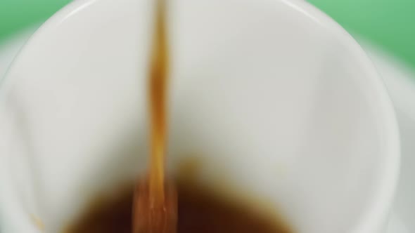 Coffee being poured into a cup