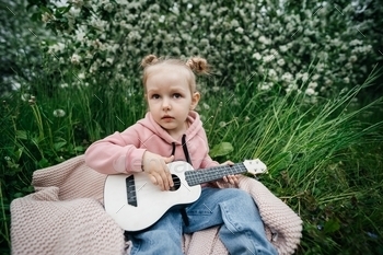 ness, fragrance of flowers, girl playing ukulele music, outdoors nature