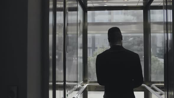 Realtor Rides an Elevator To Inspect a New Building