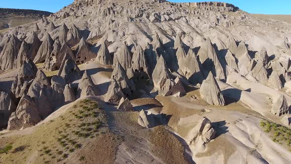 Hoodoos, Fairy Chimneys and Historical Cave Houses in Sedimentary Volcanic Rock Formations